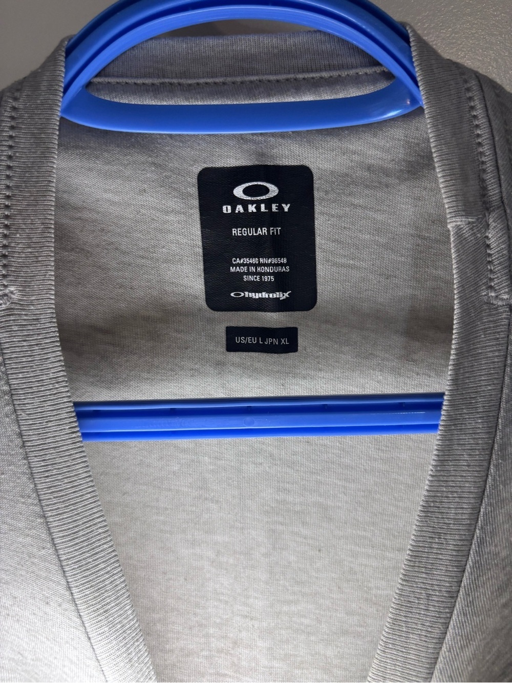 Oakley Light Gray Short Sleeve Logo Tee with Blue & Red Accents - Picture 3 of 4